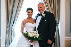 Adorable Indian bride posing with her father. Adorable Indian bride posing with her father.