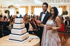Cheerful Indian bride and groom cutting the cake. Cheerful Indian bride and groom cutting the cake.