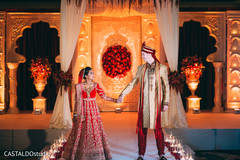 Indian bride and groom posing for pictures Indian bride and groom posing for pictures
