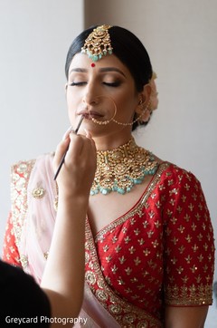 Lovely Indian bride getting her makeup done. Lovely Indian bride getting her makeup done.
