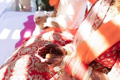 Indian bride holding a ritula item at ceremony. Indian bride holding a ritula item at ceremony.