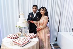 Indian newlyweds cutting the cake capture. Indian newlyweds cutting the cake capture.