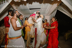 Charming groom caring Indian bride. Charming groom caring Indian bride.