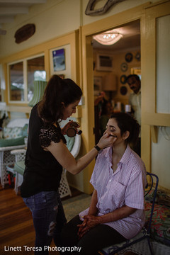 Enchanting Indian bride getting her makeup done. Enchanting Indian bride getting her makeup done.