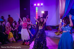 Indian bride and bridesmaids dancing with their sangeet outfits Indian bride and bridesmaids dancing with their sangeet outfits