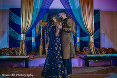 Charming Indian couple dancing during sangeet Charming Indian couple dancing during sangeet