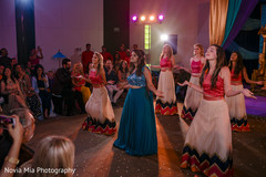 Vibrant bridesmaid performing during the sangeet Vibrant bridesmaid performing during the sangeet