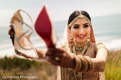Glamorous Indian bride showing her shoes. Glamorous Indian bride showing her shoes.