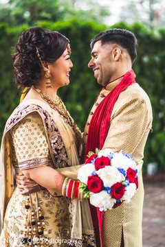 Adorable Indian bride and groom face to face out door portrait. Adorable Indian bride and groom face to face out door portrait.