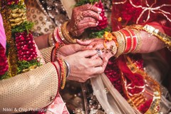 Closeup capture of Indian groom putting ring to bride. Closeup capture of Indian groom putting ring to bride.