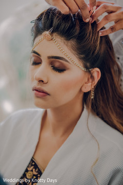Maharani being assisted with hair Maharani being assisted with hair