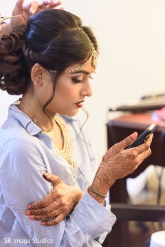 Indian bride getting her hair done. Indian bride getting her hair done.