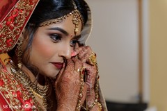 Indian bride putting her nose ring capture. Indian bride putting her nose ring capture.