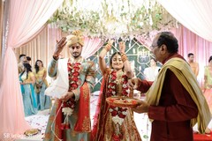 Indian couple during petals ceremony ritual. Indian couple during petals ceremony ritual.