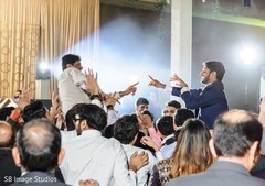 Upbeat Indian groom and guest dance performance. Upbeat Indian groom and guest dance performance.