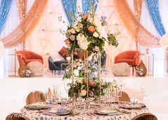 Marvelous Indian wedding reception table flowers centerpiece. Marvelous Indian wedding reception table flowers centerpiece.