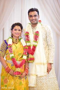 Gorgeous Indian bride and groom looking at camera Gorgeous Indian bride and groom looking at camera