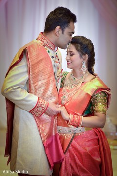 Lovely Indian groom kissing bride photo session Lovely Indian groom kissing bride photo session