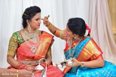 Maharani getting the red mark on her forehead. Maharani getting the red mark on her forehead.