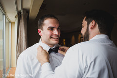 Raja being assisted by a groomsman Raja being assisted by a groomsman