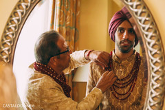 Take a look at this groom putting his mala on. Take a look at this groom putting his mala on.