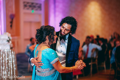 Indian groom dancing with his mother capture. Indian groom dancing with his mother capture.
