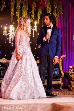 Lovely Indian bride and groom at reception speech. Lovely Indian bride and groom at reception speech.