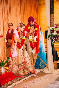 Indian couple when stepping on nuts with toes ritual. Indian couple when stepping on nuts with toes ritual.