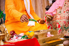 Offerings to sacred fire at Indian wedding ceremony. Offerings to sacred fire at Indian wedding ceremony.