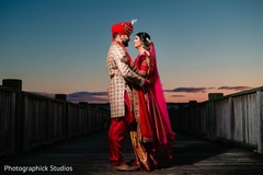 Indian bride and groom posing outdoors Indian bride and groom posing outdoors