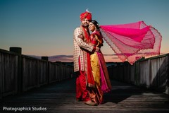 Indian bride and groom posing for pictures Indian bride and groom posing for pictures