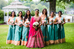 Bride posing with bridesmaids Bride posing with bridesmaids