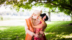 Indian bride and groom posing for pictures Indian bride and groom posing for pictures