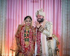 Indian couple showing their wedding rings. Indian couple showing their wedding rings.