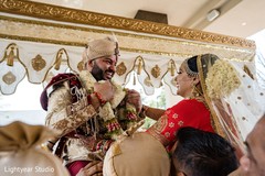 Indian bride and groom exchanging garlands. Indian bride and groom exchanging garlands.