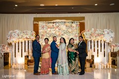 Indian bride and groom and parents posing for photo shoot. Indian bride and groom and parents posing for photo shoot.