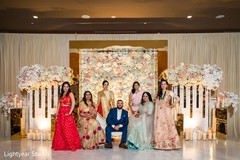 Elegant Indian couple and bridesmaids posing for photo shoot. Elegant Indian couple and bridesmaids posing for photo shoot.