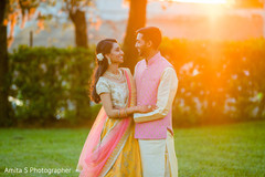 Outdoors Indian couple on their sangeet outfits. Outdoors Indian couple on their sangeet outfits.
