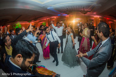 Cheerful Indian bride and groom dancing. Cheerful Indian bride and groom dancing.