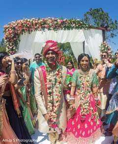 Joyful Indian couple walking out of ceremony. Joyful Indian couple walking out of ceremony.