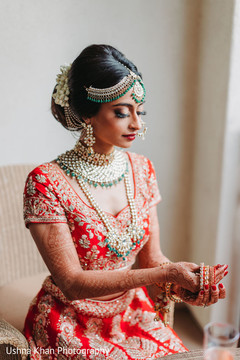 Stunning Indian bride puttin on her bangles. Stunning Indian bride puttin on her bangles.