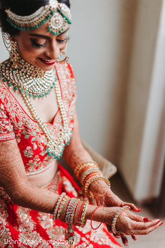 Indian bride getting ready putting her chooras. Indian bride getting ready putting her chooras.