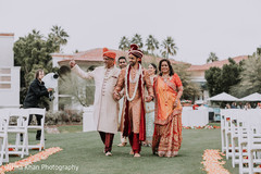 Indian groom walking in to wedding ceremony aisle. Indian groom walking in to wedding ceremony aisle.