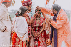 Indian groom puttin the red mark on maharani ritual. Indian groom puttin the red mark on maharani ritual.