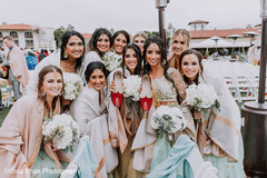 Indian bridesmaids holding rajah's wedding shoes. Indian bridesmaids holding rajah's wedding shoes.
