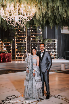 Sweet shot of Indian couple at reception dance floor. Sweet shot of Indian couple at reception dance floor.