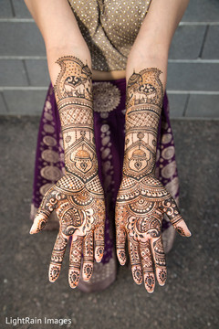 Beautiful indian bride showing henna art Beautiful indian bride showing henna art
