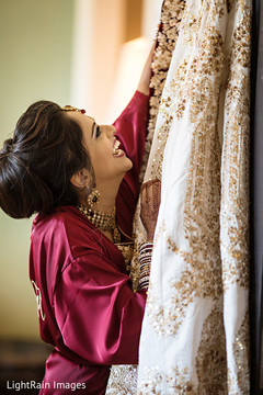 Gorgeous indian bride getting her lehenga. Gorgeous indian bride getting her lehenga.