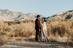 Indian bride and groom posing for pictures Indian bride and groom posing for pictures