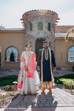 Indian bride and groom posing for pictures Indian bride and groom posing for pictures